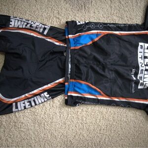 Life Time Fitness Cycling Set Black Orange Blue